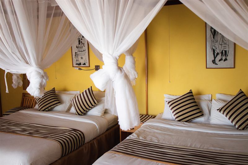 A room at Kerio View with twin beds under mosquito nets